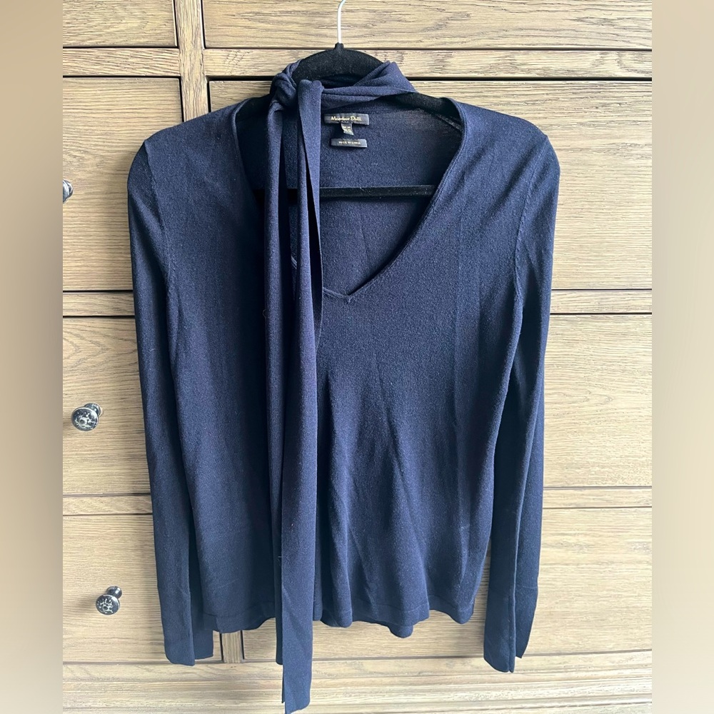 Light knit navy sweater with extra details.